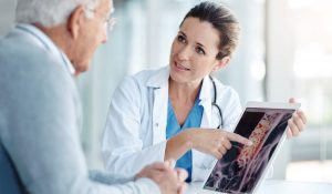 Doctor discussing spine scan with patient